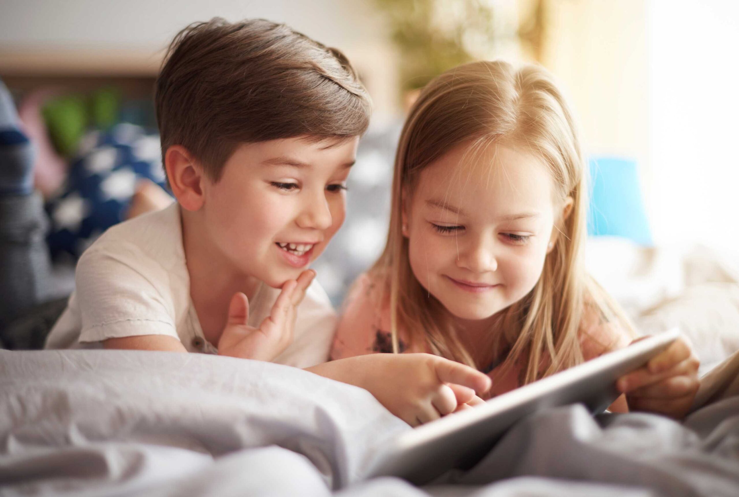 Kids reading a book together
